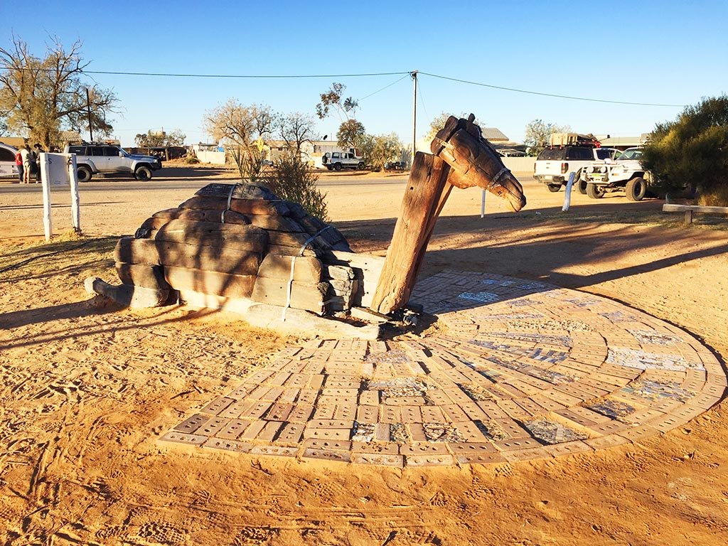 Camel sundial built from old railway sleepers in the centre of Marree, South Australia
