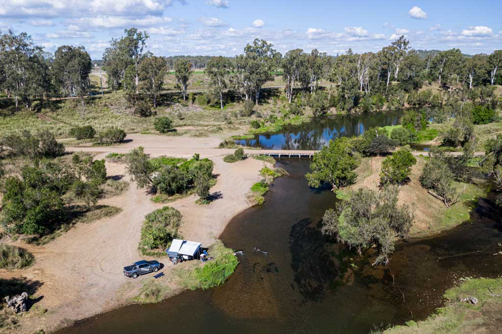 Aerial view of river and campsite
